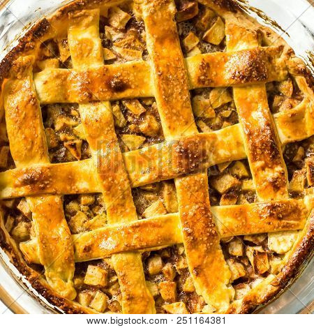 Traditional American Apple Pie With Dough Decoration In A Grid On A White Table. Autumn Baking Conce