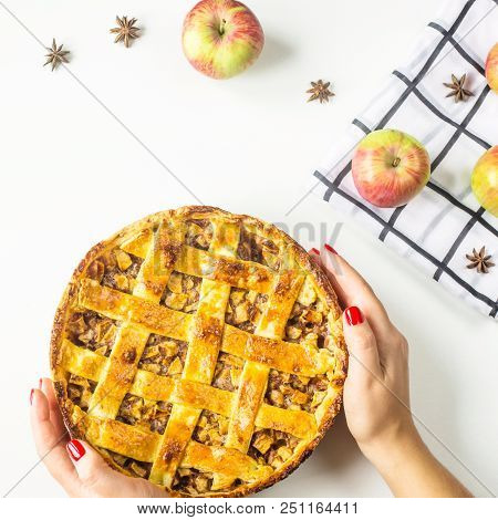 Traditional American Apple Pie With Dough Decoration In A Grid On A White Table. Autumn Baking Conce