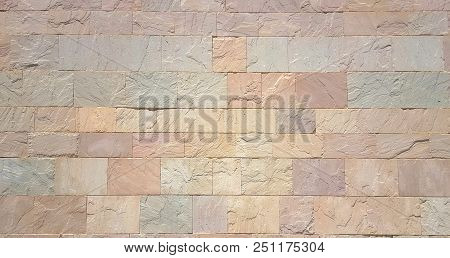 Stone Wall Background From Modern Building Contruction Facade.