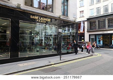 London, Uk - July 9, 2016: People Walk By Saint Laurent Fashion Shop At Mayfair, London. Mayfair Is 