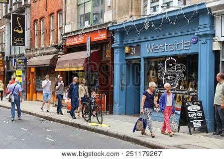 London, Uk - July 9, 2016: People Visit Musical Instruments Shops At Denmark Street, London. Denmark