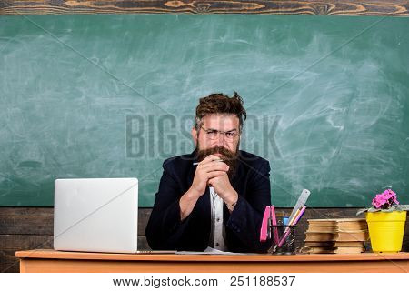 Teacher Bearded Mature Schoolmaster Listening With Attention. Teacher Formal Wear Sit At Table Class