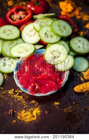 Close Up Ingredeints Of Ayurvdic Face Pack Of Vegetables I.e. Sliced Cucumber,tomato Puree,and Turme