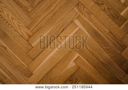 Brown Wood Parquet Texture On The Floor In The Apartment