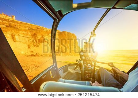 Helicopter Cockpit Interior Flying On Azenhas Do Mar Beach At Sunlight, The Atlantic Ocean In Portug