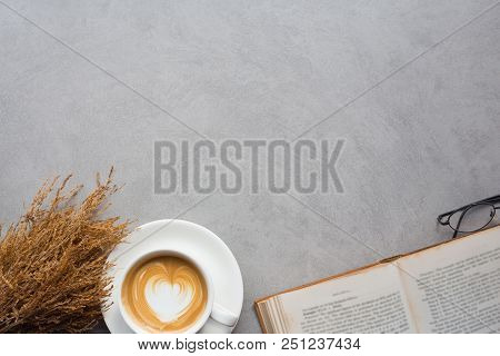 A Coffee In The Cup And A Novel Book  In Reading Time , Flat Lay Image And Copy Space For Your Text