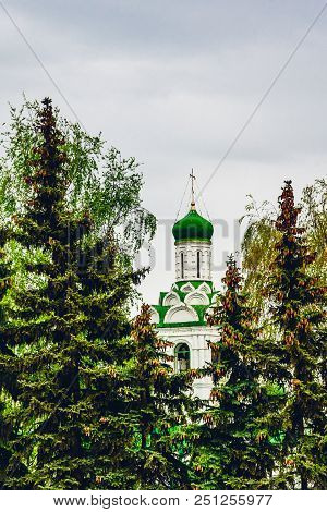 Beautiful Church Of St. John The Baptist Monastery Between Fir Trees. Kaxan, Russia.