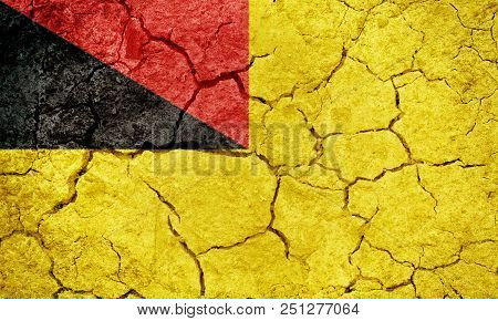 Negeri Sembilan, State In Malaysia, Flag On Dry Earth Ground Texture Background