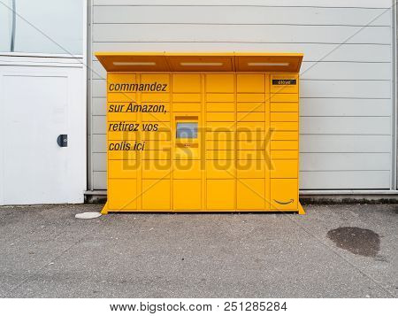Strasbourg, France - Mar 17, 2018: Front View Of Amazon Locker Orange Delivery Package Locker In Pub
