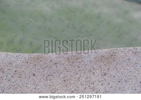 Background Of Granite And Water In The Background