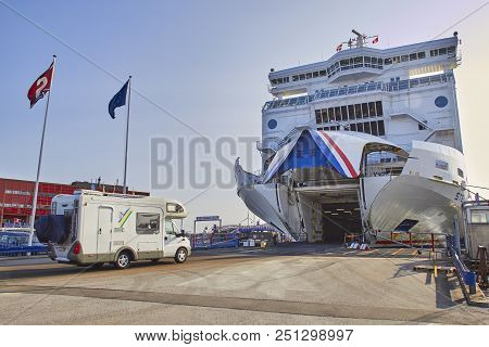 Denmark, Hirtshals- June 05, 2013: Tourist Bus Camping Rides Into The Ferry