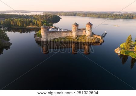 Olavinlinna Fortress In The Kuusalmi Strait On A July Morning (aerial Survey). Finland, Savonlinna