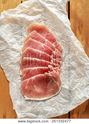 Butchers Made Free Range Raw Lean Unsmoked Bacon Pork Medallions And Hen Eggs On Wooden Box.