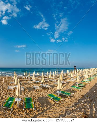 Morning Paradise White Sandy Beach With Sunshades And Sunbeds (salento, South Italy). The Most Beaut