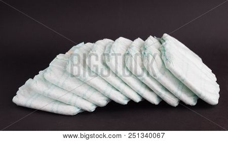 Baby Diapers On A Black Background, Diaper, Diapering