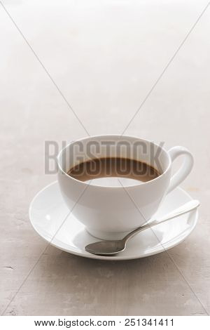 White China Cup Of Tea With Milk On A Plain Background