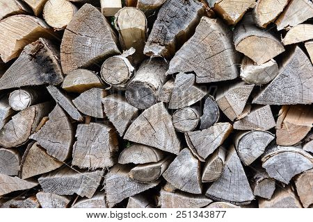 Background Of Neatly Stacked Firewood. Texture Of Dry Wood, Log.