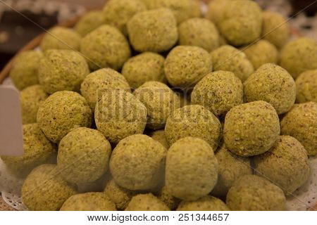 Asorted Chocolate Truffles And Pralines. Chocolate And Coconut Candies On The Counter In The Confect