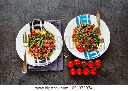 Flat-lay Of Vegan Beans Salad In Plates With Micro Greens, Tomatoes And Aspargus. Healthy Energy Boo