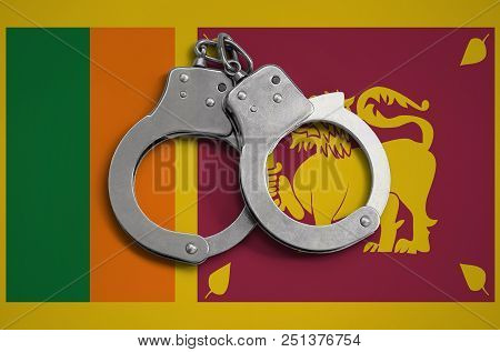 Sri Lanka Flag  And Police Handcuffs. The Concept Of Observance Of The Law In The Country And Protec