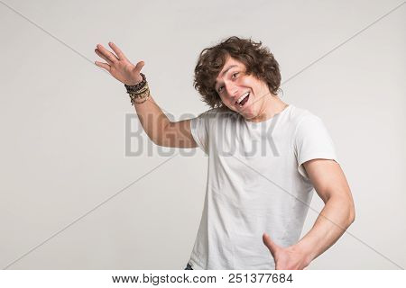 Portrait Of White Handsome Young Men Having Fun In White T-shirt With Stylish Bracelet