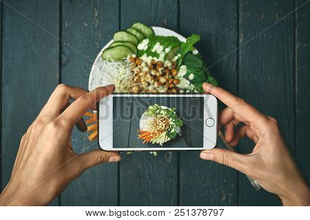 Woman Taking Pictures Buddha Bowl With Vegan Food, Fried Chickpeas, Rice Noodles With Wegetables On 