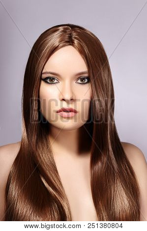 Beautiful Yong Woman With Long Straight Brown Hair. Sexy Fashion Model With Smooth Gloss Hairstyle.