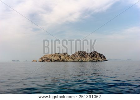 Unpopulated Rock Island In The Sea Far From Main Land