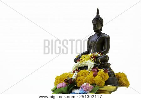 Bronze Cast Buddha Image Decorate With Beautiful Flowers And Garland For Pray On Songkarn Festival I