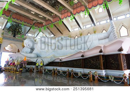 Udonthani, Thailand - March 17, 2018 : Gigantic White Marble Reclining Buddha In Buddhism Sacred Hal