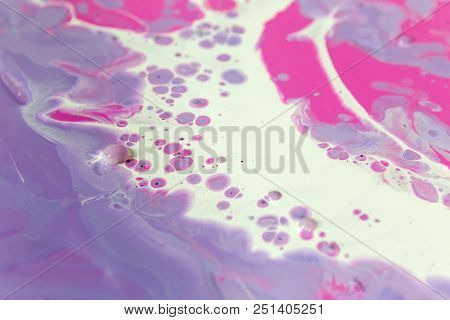 Abstraction Of The Flowing Multi-colored Acrylic Paints