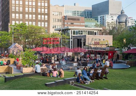 Montreal, Ca - 27 May 2017: People Relaxing In The Jardins Gamelin In The Emilie Gamelin Square