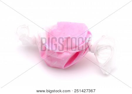 Single Piece Of Pink Salt Water Taffy On A White Background