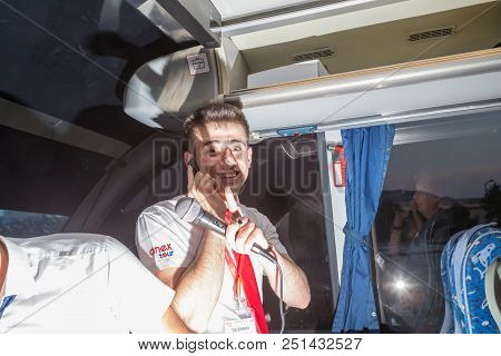 Marmaris, Turkey - May 19, 2018: Male Tour Guide With A Microphone In The Bus In Evening Time