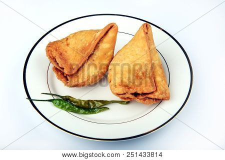 Samosa An Indian Popular Street-food In A White Plate