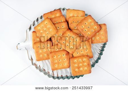 Sweet And Salty Biscuits In A Glass-plate On White Background