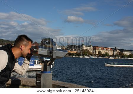Zurich, Switzerland: Sep 21, 2017 - Man Looking Landscape Of Zurich, Switzerland