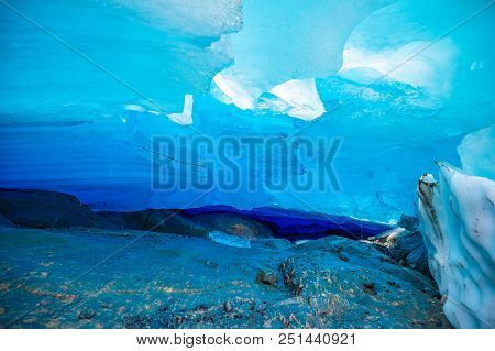 Blue Ice Cave Of Svartisen Glacier In Norway