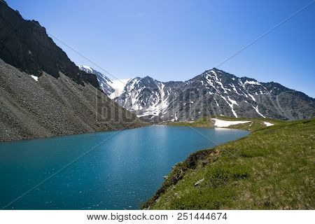 Amazing Mountain Landscape. Altay Stone Mushrooms. Mountain Like Flowing Between High Snow-capped Mo