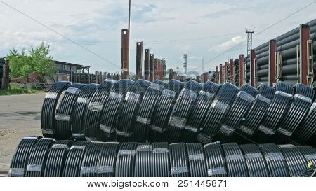 Warehouse Of Finished Plastic Pipes Industrial Outdoors Storage Site. Manufacture Of Plastic Water P