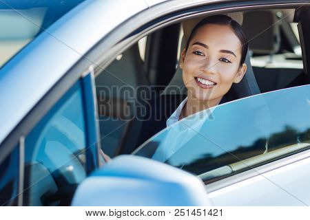 On My Way. Delighted Cheerful Woman Driving Her Car While Going To Work