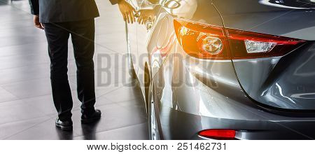 Man Business Saleman Open Door Car On Street Blurry Background.for Automotive Automobile Or Transpor