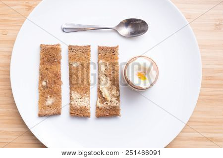 Soft Boiled Eggs With Toast On A White Plate. Breakfast