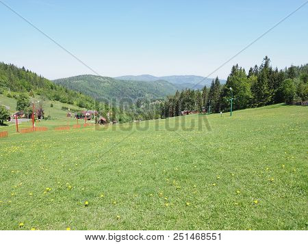 Abandoned Green Grassy Field And Forest At Beskid Mountains Range Landscapes In European Salmopol Pa