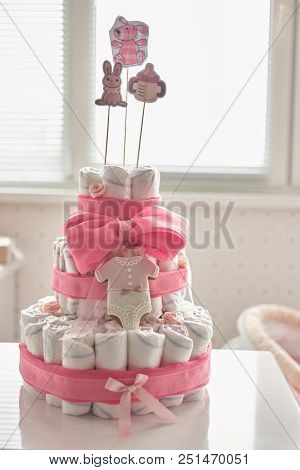Newborn Gift Concept. Decorated Cake Of Diapers Indoor.
