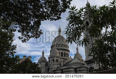 The Basilica Sacre Coeur Is A Roman Catholic Church Located At The Summet Of The Butte Montmartre , 