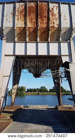 Rusty Sand Silo Along Riverside Of The River Hollandsche Ijssel To Transport Sand From Inland Ships 