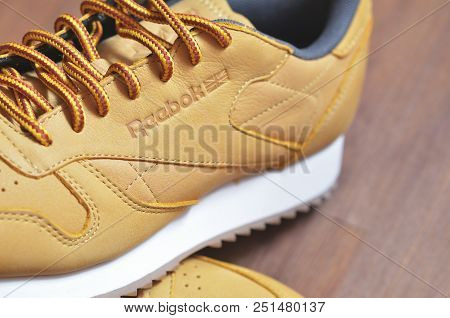 Kiev, Ukraine - May 30, 2018: Reebok Sneakers Stands On A Sneaker On A Dark Wooden Background
