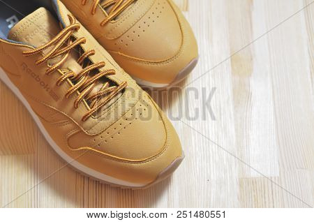 Kiev, Ukraine - May 30, 2018: Reebok A Pair Of Light Sneakers Stands In The Upper Left Corner On A W