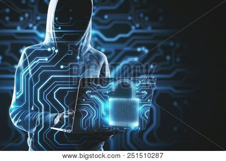 Hacker With Laptop And Digital Padlock On Abstract Glowing Circuit Background. Malware And Attack Co